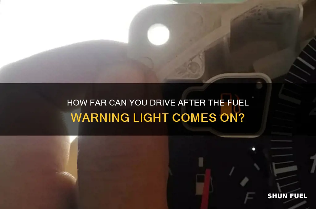 how many miles can i can when fuel warning light