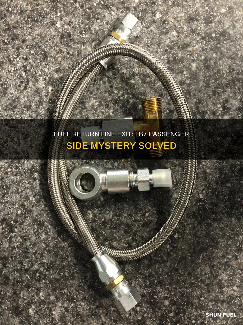 where does lb7 passenger side fuel return line exit head