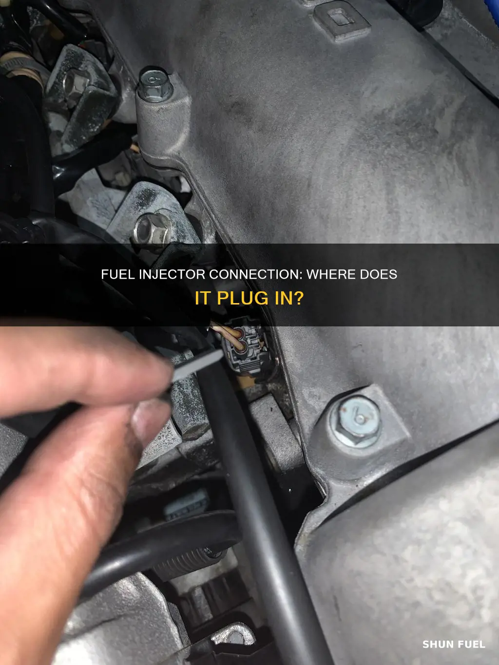 where does the fuel injector connect to in engine