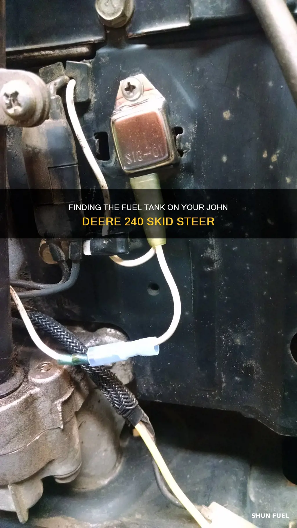 where is fuel tank on john deere 240 skid steer