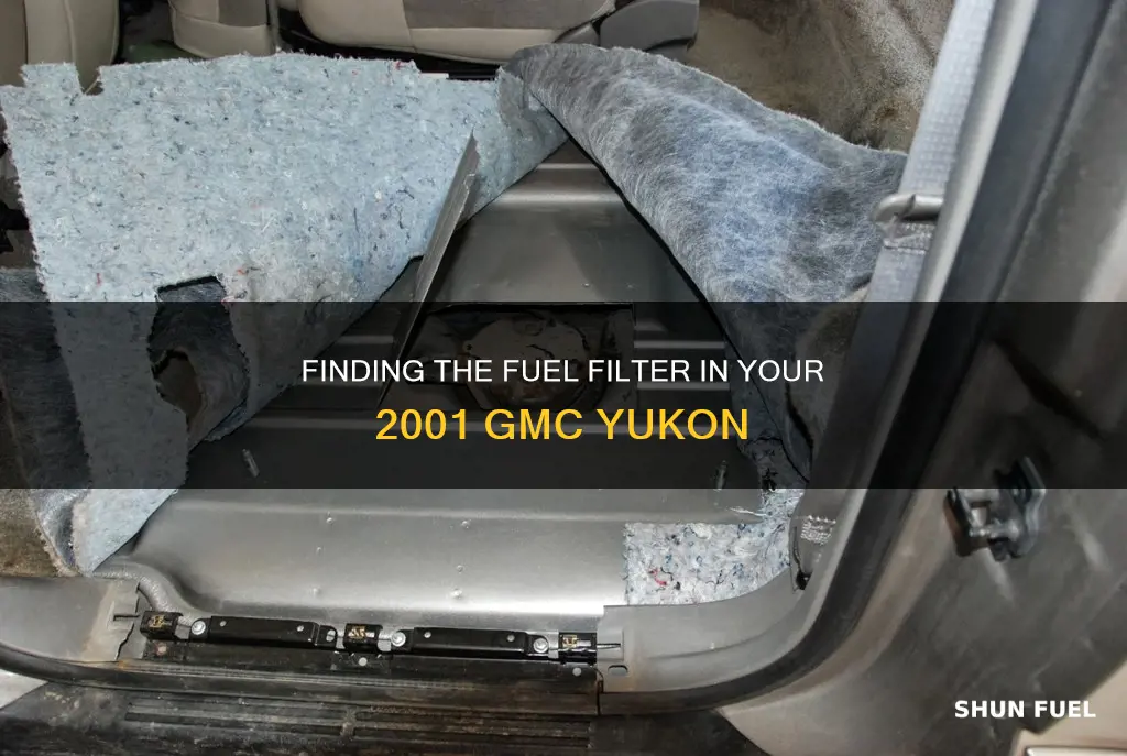 where is the fuel filter for gmc yukon 2001
