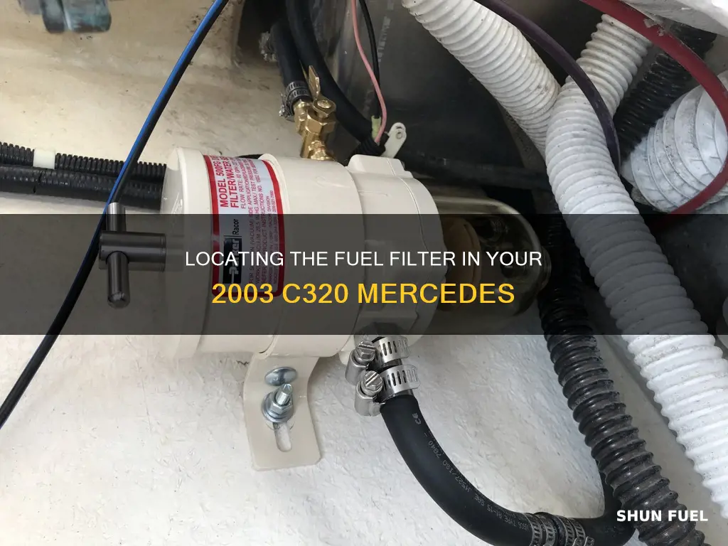 where is the fuel filter in a 2003 c320