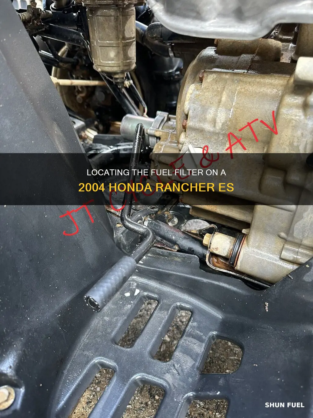 where is the fuel filter on 2004 honda rancher es