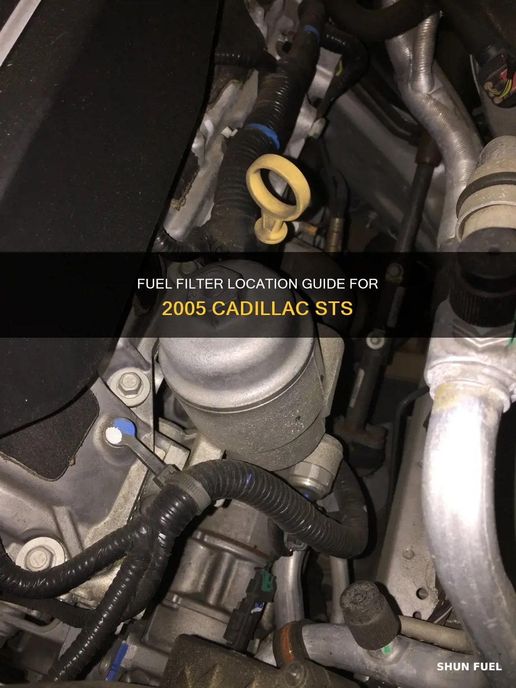where is the fuel filter on a 2005 cadillac sts