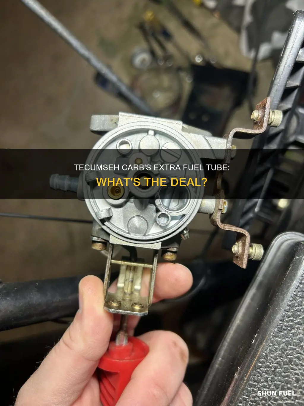 why does tecumseh replacement carb have extra fuel tube inlet